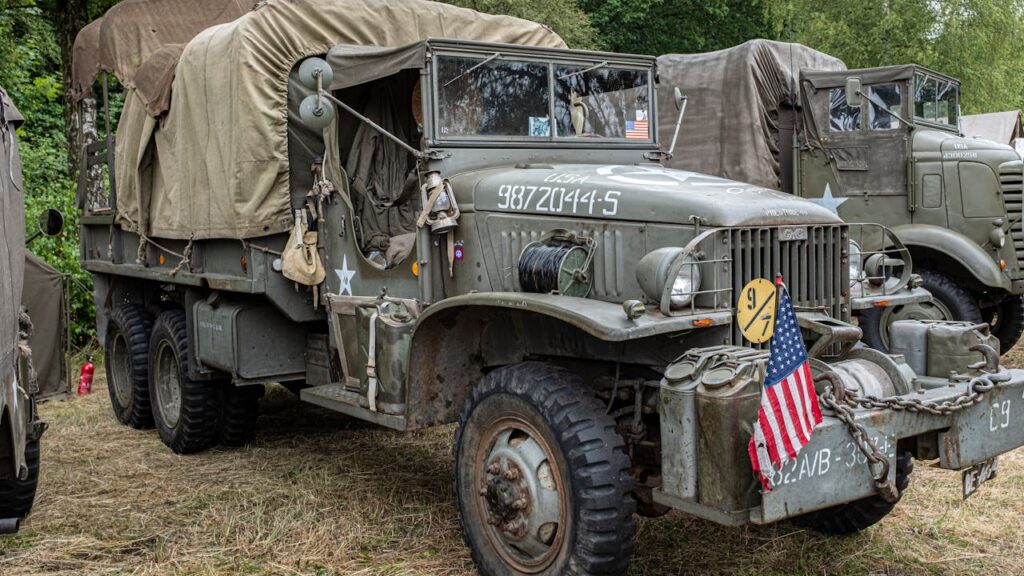 Crafting Captivating Headlines: Your awesome post title goes here Rustic military truck parked outdoors with canvas cover and American flag.